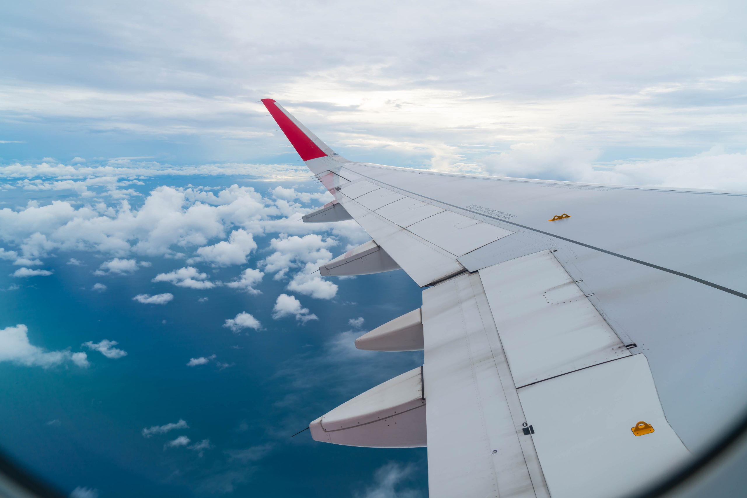Airplane flying above many clouds